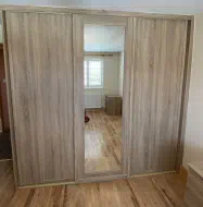 3 door wardrobe with 2 plain panel doors and a shaker door in the middle, fitted in Whitby